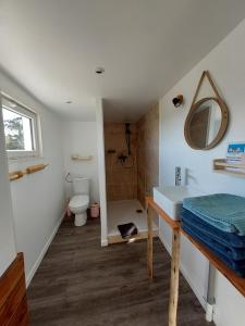a bathroom with a sink and a toilet at Mas Constantin in Salin-de-Giraud