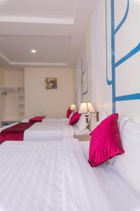 Postel nebo postele na pokoji v ubytování Vy Anh Đà Lạt Hotel
