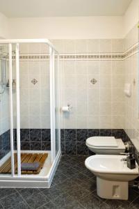 a bathroom with a toilet and a shower at Casa Aaron in Tremosine Sul Garda +20 photos