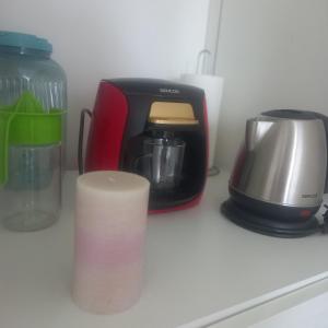 a toaster and coffee maker sitting on a counter at Apartmán s výhľadom na Spišský Hrad in Studenec