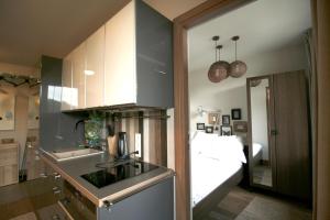 a kitchen with a sink and a counter top at Aba Apartamenty in Krynica Zdrój