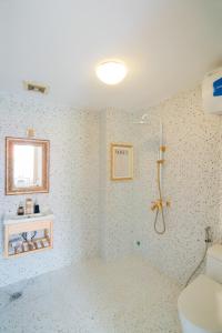 Ванная комната в Langmandi Experience 2PD