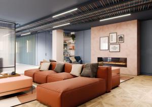 a living room with a couch and a fireplace at Sleek Studios, Apartments and Private Bedrooms at Silk Mill close to Edinburgh Old Town in Edinburgh