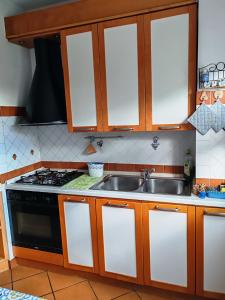 a kitchen with a sink and a stove at Talenti house in Rome