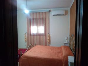 Postel nebo postele na pokoji v ubytování Lampedusa da Sogno 1