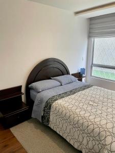 GOYA Suites y Comfort tesisinde bir odada yatak veya yataklar