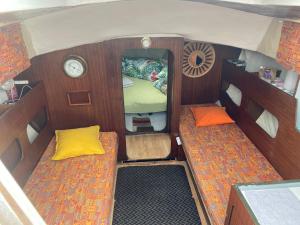 an overhead view of a small boat with two beds at Nuit insolite dans un petit voilier in La Rochelle