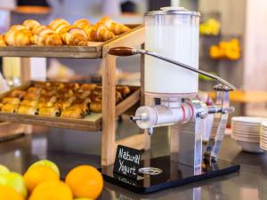 a food blender sitting on a counter with pastries at ibis London City - Shoreditch in London