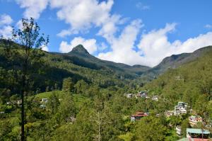 a view of a valley with mountains in the background at Blue Sky Guest House And Restaurant in Nallathaniya