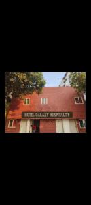 a building with a sign that reads hotel galaxyhospital at Collection O 83129 Hotel Galaxy Hospitality in Kharadi