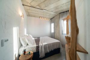 Llit o llits en una habitació de Kikonia Art & Suites