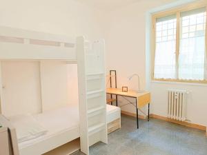 a bedroom with two bunk beds and a desk at [Rome] House with garden near the Olympic Stadium in Rome