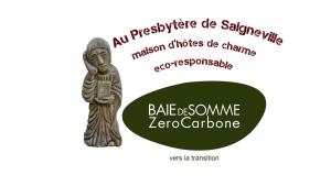 een afbeelding van een houten beeldje van een beeldje bij Au Presbytère de Saigneville in Saigneville