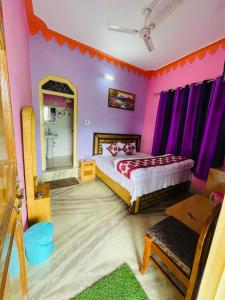 En eller flere senger på et rom på Bagwari Guest House