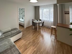 a room with a bed and a table with chairs at Tallinn Panorama Apartment Majaka in Tallinn