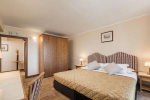 Postel nebo postele na pokoji v ubytování Relais La Fattoria