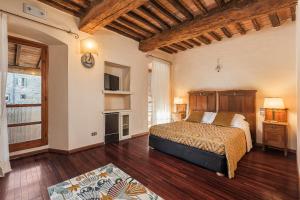 Postel nebo postele na pokoji v ubytování Relais La Fattoria