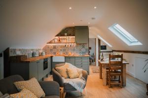 a kitchen and living room with an attic at Hafan in Glasbury