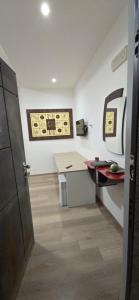 a room with a office with a desk and a counter at prestige house 5 in Scalea