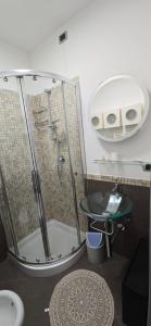 a bathroom with a shower and a sink at prestige house 5 in Scalea