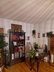 a room with a desk and a book shelf at Disponentgata Malmo Apartment in Malmö