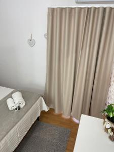 A bed or beds in a room at ORTIGIA 26