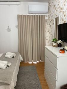 A television and/or entertainment centre at ORTIGIA 26