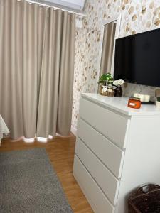 A television and/or entertainment centre at ORTIGIA 26