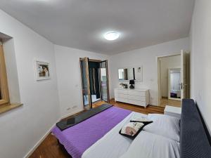 a bedroom with a large bed in a room at Sweet suite in Makarska