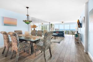 a dining room with a table and chairs at Shoreline Towers 3063 in Destin