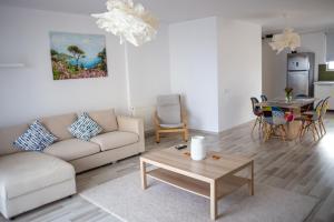 a living room with a couch and a table at Olimp 35 in Olimp