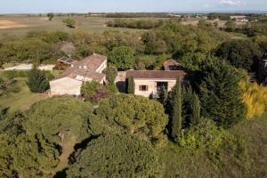 an aerial view of a house in the trees at Demeure de Charme La Source in Cestayrols
