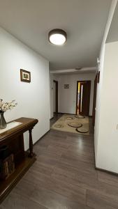 an empty room with a table and a carpet at Skyline Villa in Azuga +13 photos
