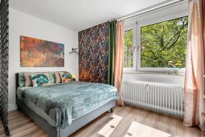 Ένα ή περισσότερα κρεβάτια σε δωμάτιο στο Urban Jungle Studio Apartment