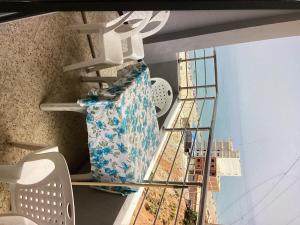 a shelf in a room with a view of a city at Plage in Douar Chaïb Rasso