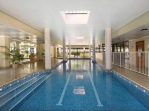 a large indoor swimming pool in a building at Fantastic 3 Bds apartment Darling Harbour & Fish Market & Chinatown & Casino & Central in Sydney