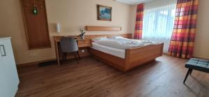 Voodi või voodid majutusasutuse Hotel Falknerei Galina toas