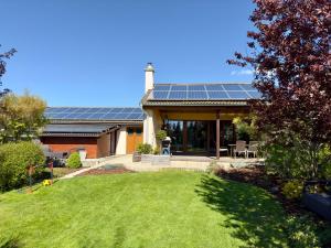 a house with solar panels on the roof at Apartmán Němčice u Boskovic in Němčice