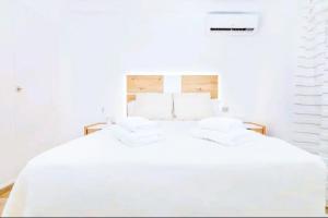 Łóżko lub łóżka w pokoju w obiekcie Apartamento Puerto Sol y Mar
