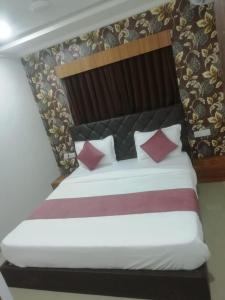 Postel nebo postele na pokoji v ubytování Hotel MD Grand