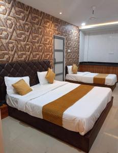 Postel nebo postele na pokoji v ubytování Hotel MD Grand