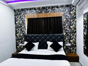 Postel nebo postele na pokoji v ubytování Hotel MD Grand