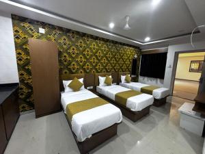 Postel nebo postele na pokoji v ubytování Hotel MD Grand