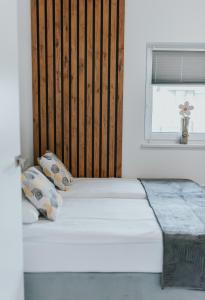 Łóżko lub łóżka w pokoju w obiekcie APARTAMENTY LAS Zator
