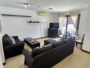 TV a/nebo společenská místnost v ubytování Duplex Noray vista a la piscina