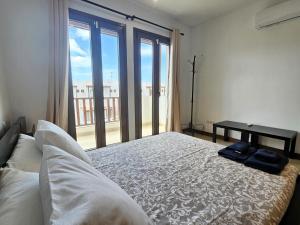 Postel nebo postele na pokoji v ubytování Duplex Noray vista a la piscina + 31 fotografií