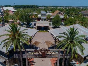 an aerial view of a resort with palm trees at Tinsley - Patio Villa In The Village Of Hawkins in The Villages