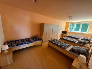 Postel nebo postele na pokoji v ubytování Apartmány Kněžičky