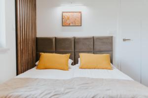Łóżko lub łóżka w pokoju w obiekcie APARTAMENTY LAS Zator