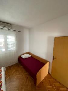 Postel nebo postele na pokoji v ubytování Apartment Martina Tučepi